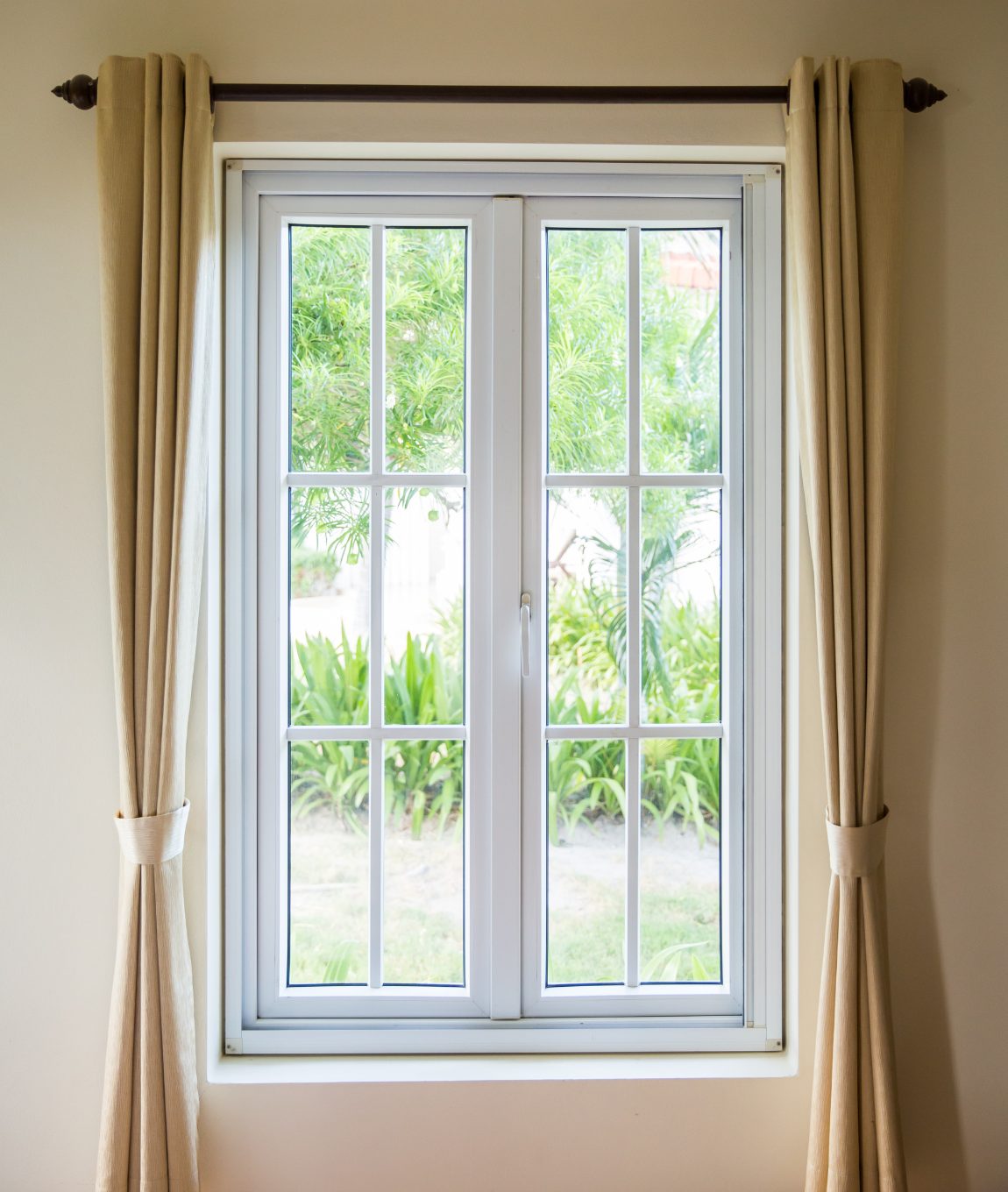 window with beige curtains
