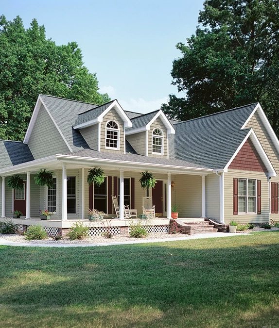 two-storey home with grey siding and a covered front porch
