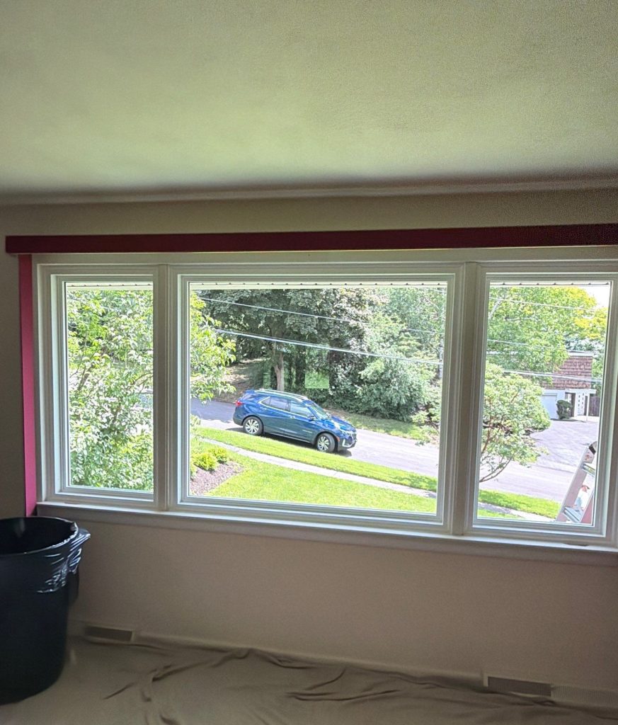 Interior before image of the three-lite deadlight front window of the Syracuse Raised Ranch.