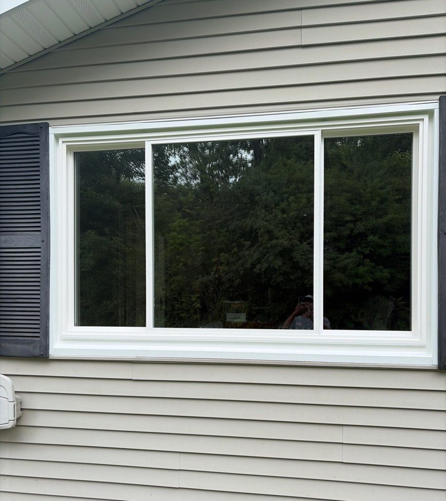 Exterior view of brand-new slider windows after installation.