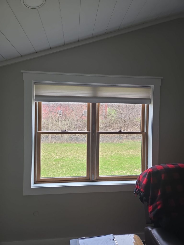 Interior view of old double-hung bedroom window prior to installation of the new window.