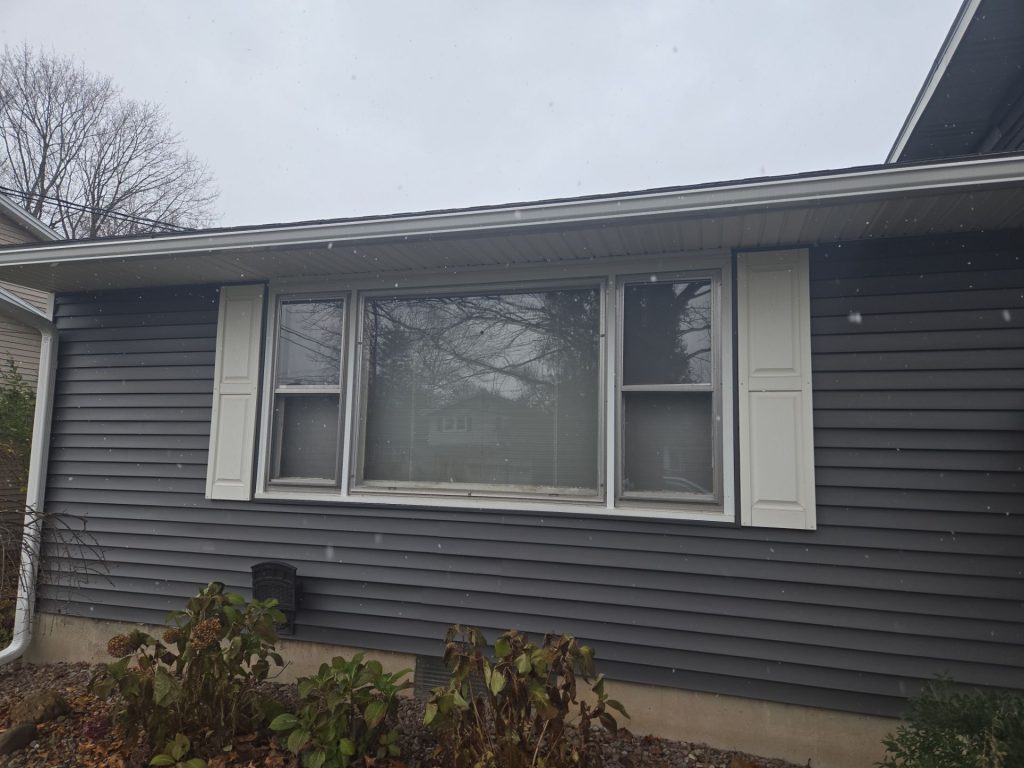 Flat front window of 1960s Queen Anne home in North Syracuse before new replacement installation.