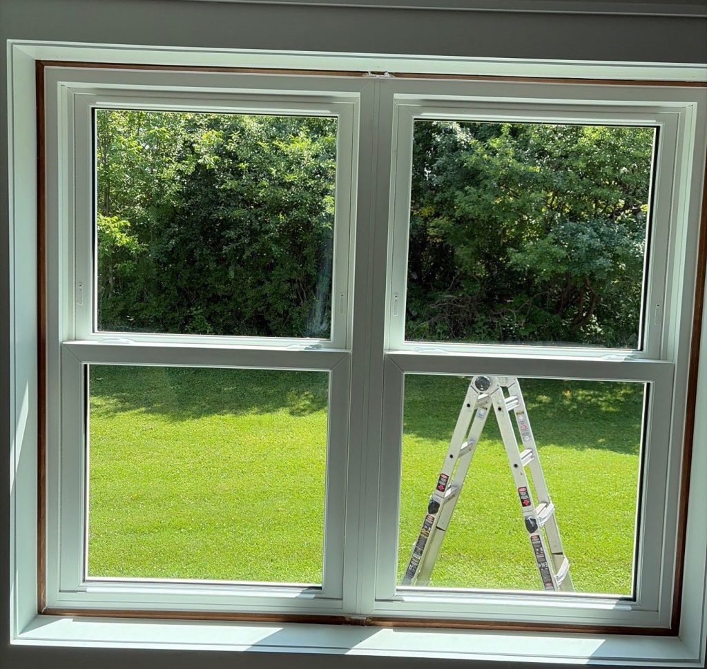 Interior view of new double-hung bedroom window after installation.